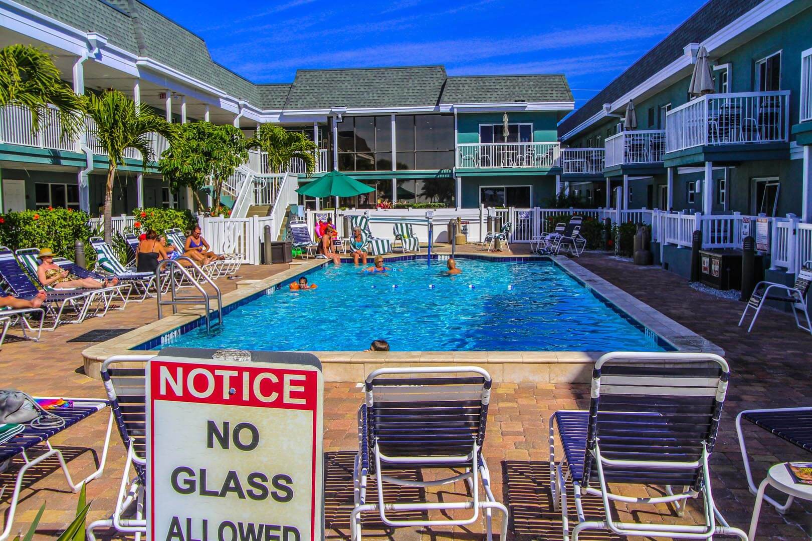 An outdoor swimming pool at VRI's Mariner Beach Club in St. Pete Beach, Florida.